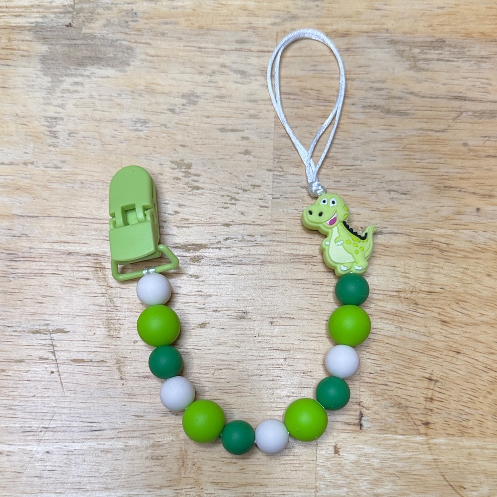 Green and White Dinosaur Pacifier Clip